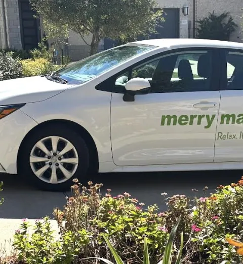 merry maids branded vehicle parked in a driveway